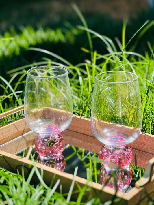 COPO TRANSPARENTE COM BASE ROSA